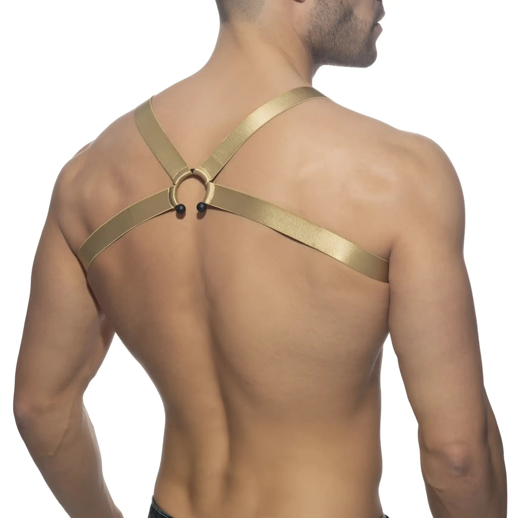 Gold metallic bull ring harness with central circular ring and black spherical accents designed for stylish wear