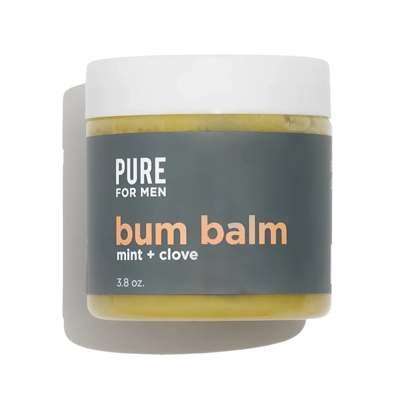 A matte white jar of pure for men bum balm with a dark gray label and yellowish green mint and clove balm