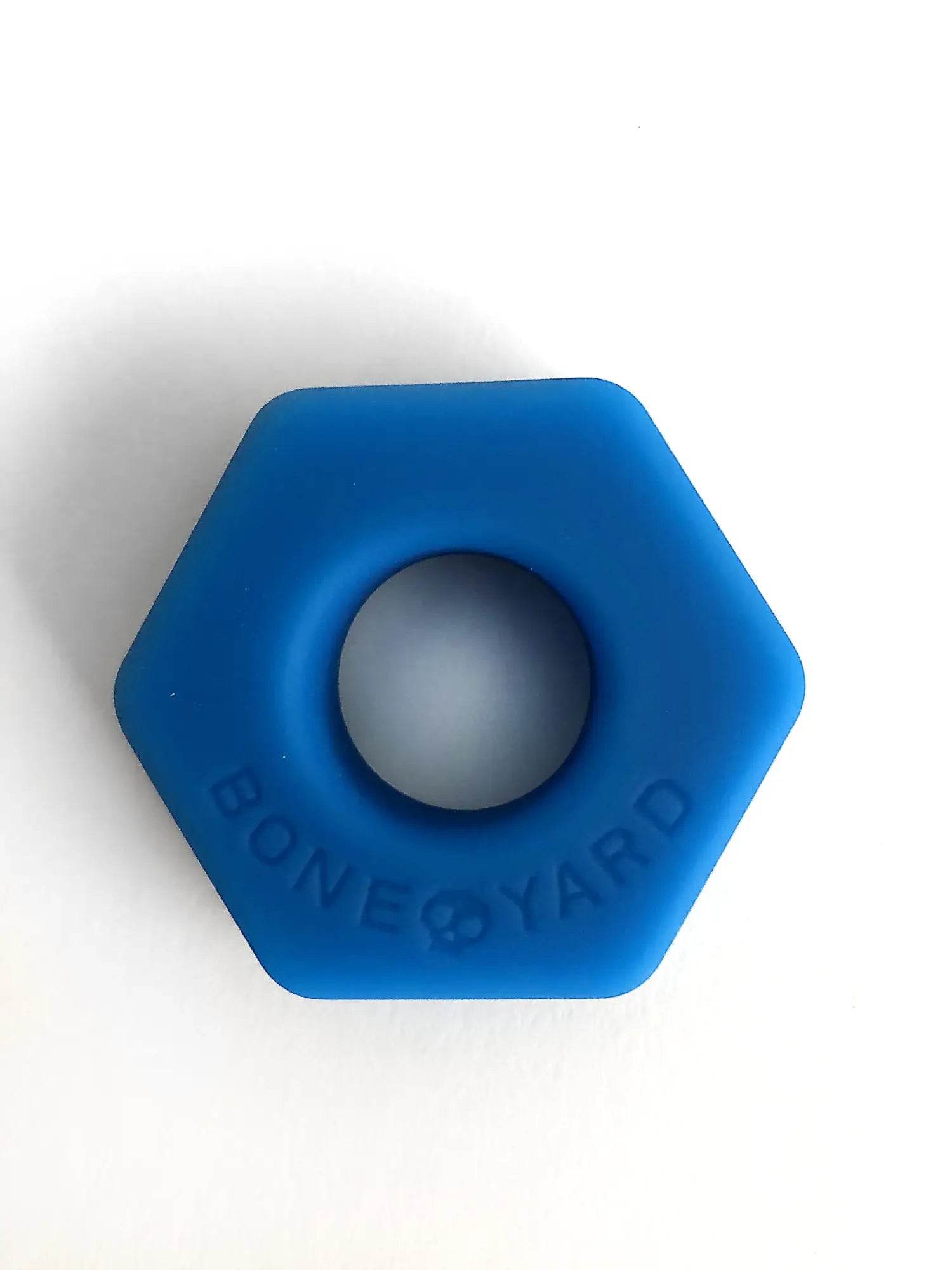 Blue hexagonal silicone ring titled bust a nut with bone yard engraved on its side