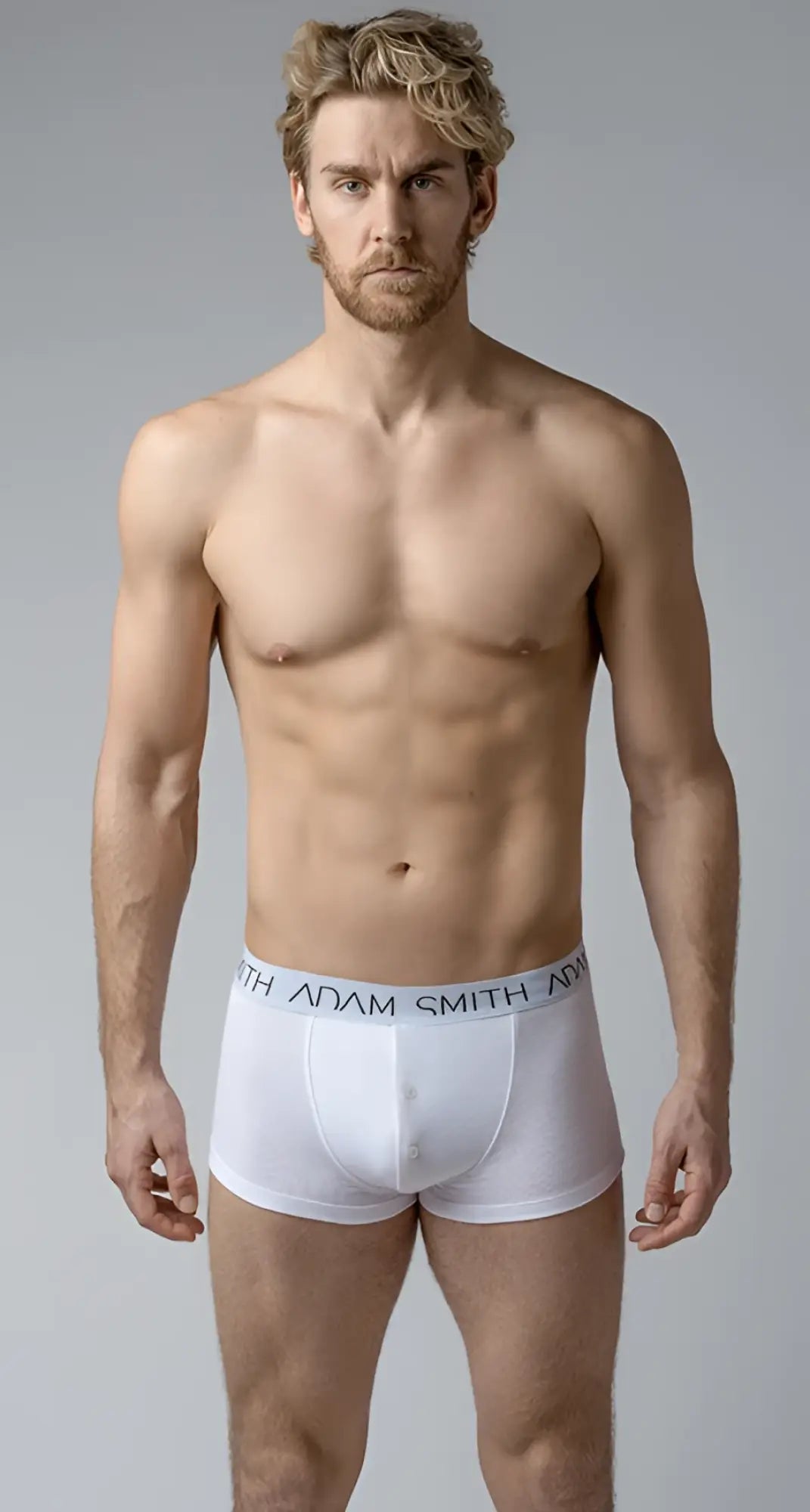 White adam smith boxer briefs button front trunks with light gray elastic waistband and black brand lettering