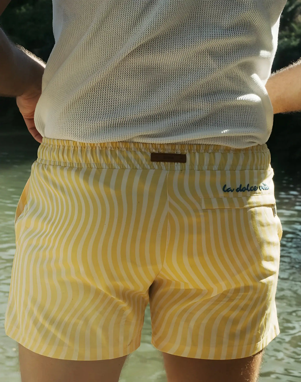 Byron swim short in yellow with white wavy stripes and brown leather la dolce vita brand tag