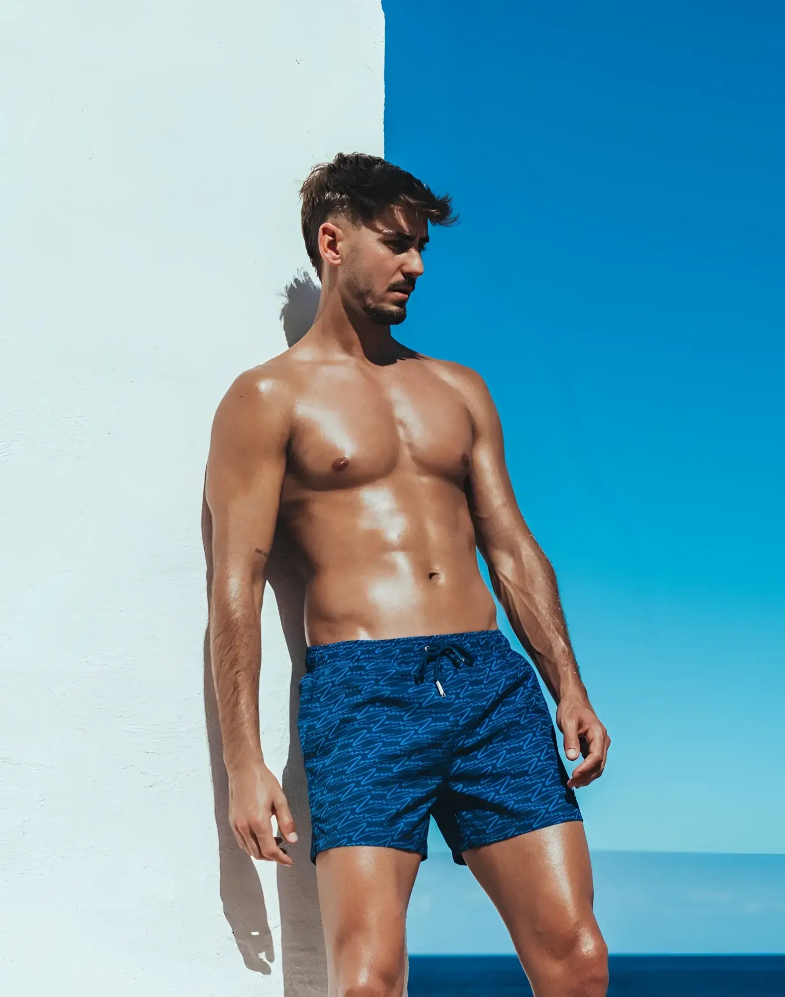 Blue patterned Byron swim short with drawstring waistband designed for comfortable beachwear use