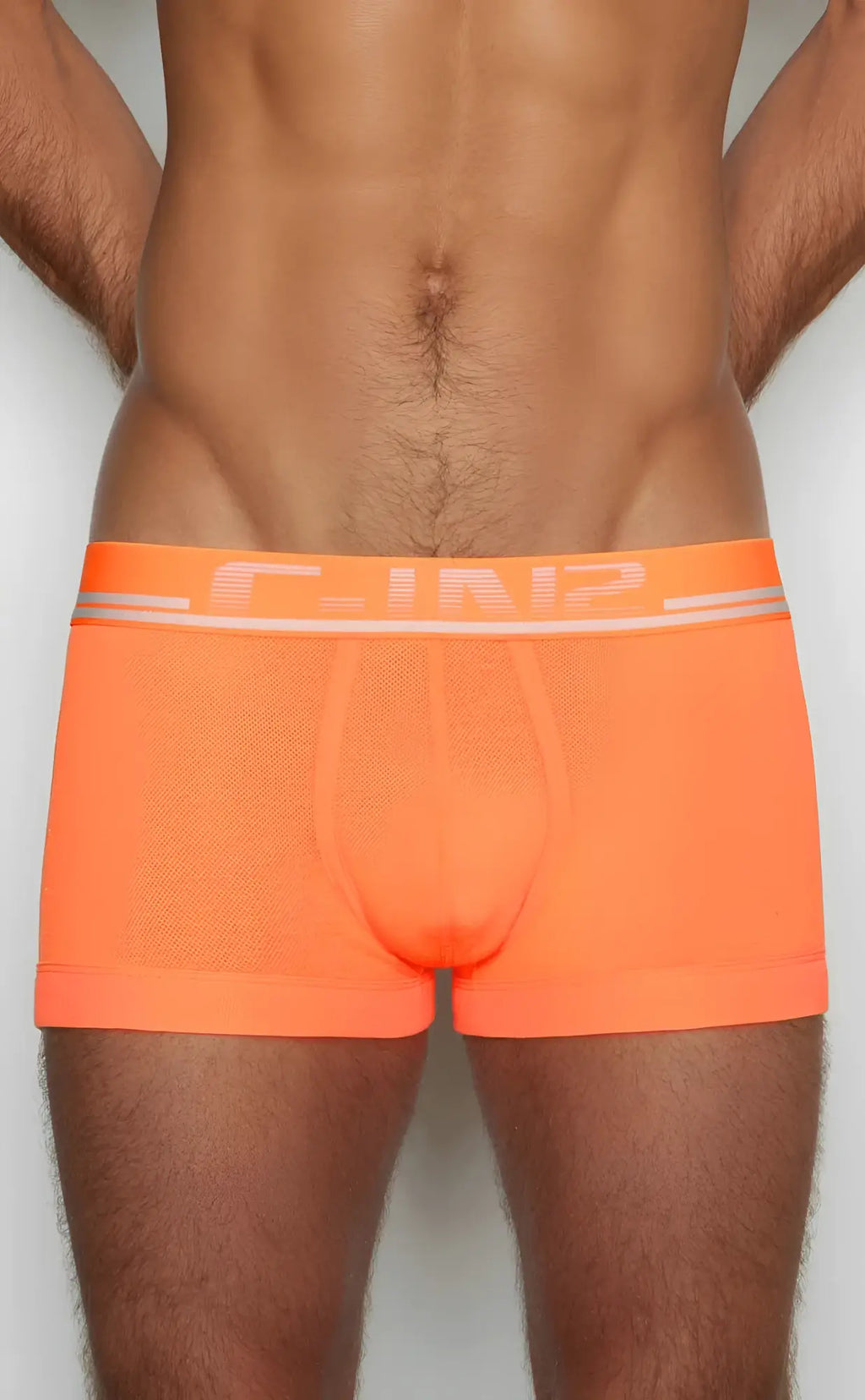 Bright orange c-in2 trunk 1023 men’s briefs with mesh texture and white logo trim front view