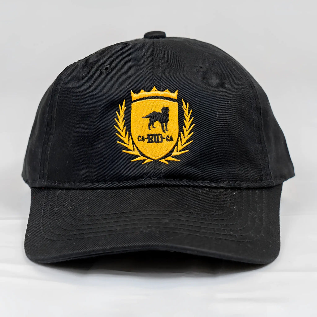 Black cotton ca-rio-ca crest logo embroidered dad hat with yellow shield, black dog silhouette, and laurel wreath design