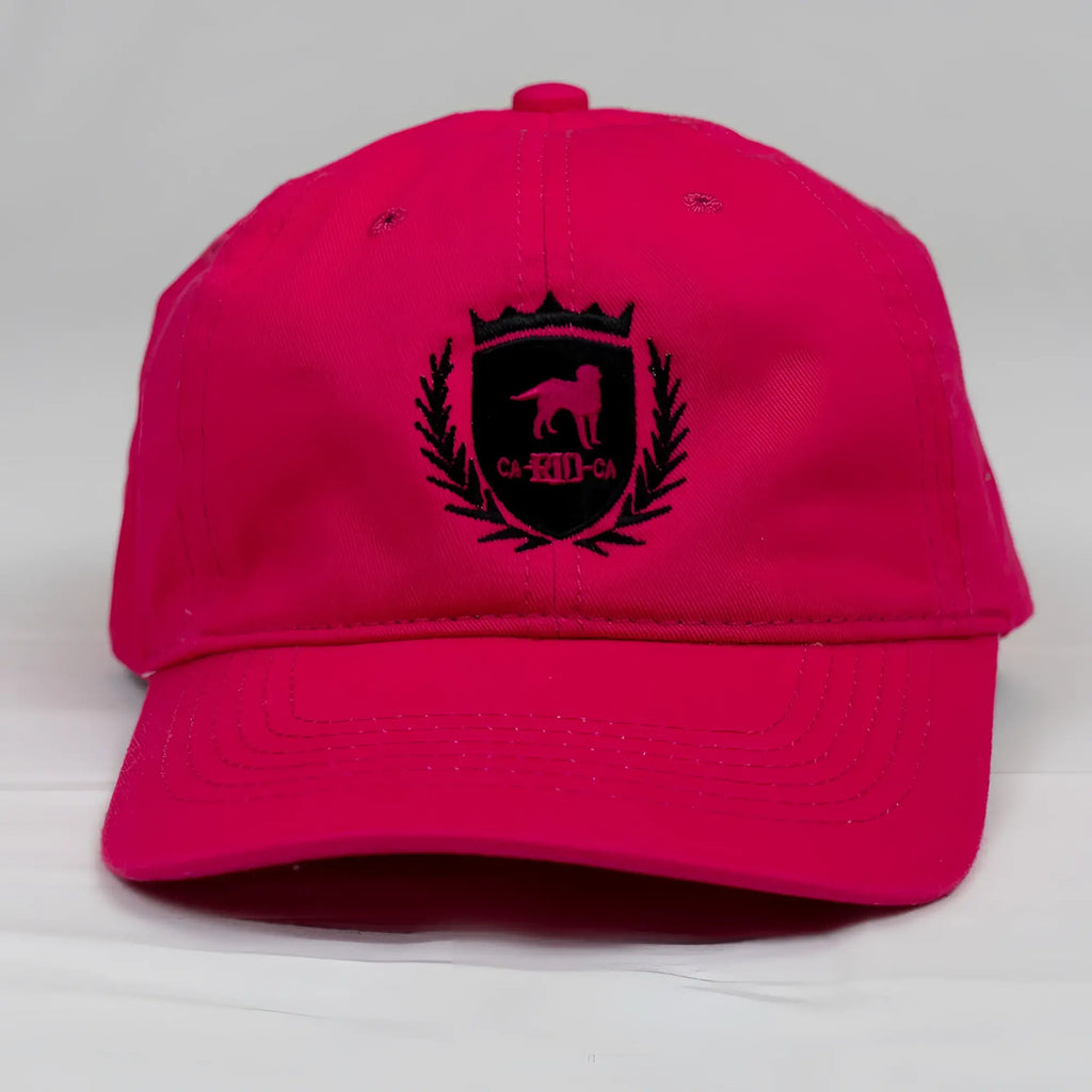 Vibrant pink cotton CA-RIO-CA crest logo embroidered designer dad hat with black dog silhouette crown and laurel wreath