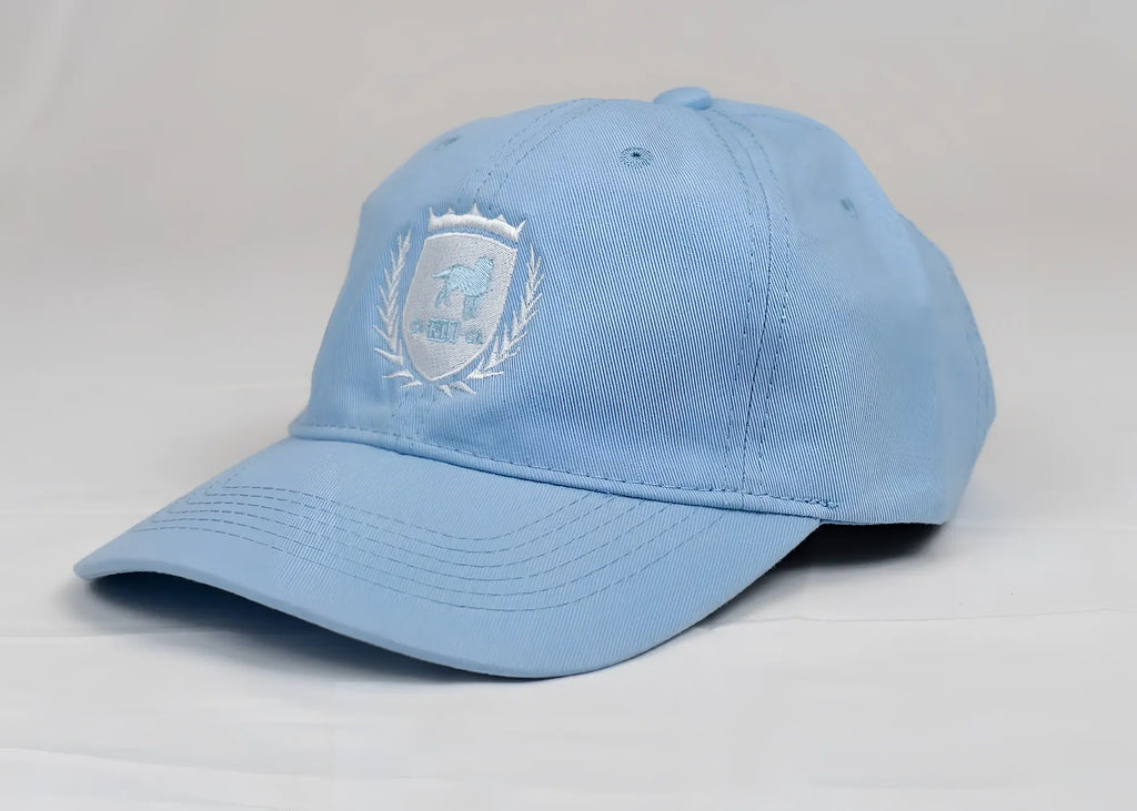Light blue cotton CA-RIO-CA crest logo embroidered designer dad hat featuring a subtle lion and laurel wreath