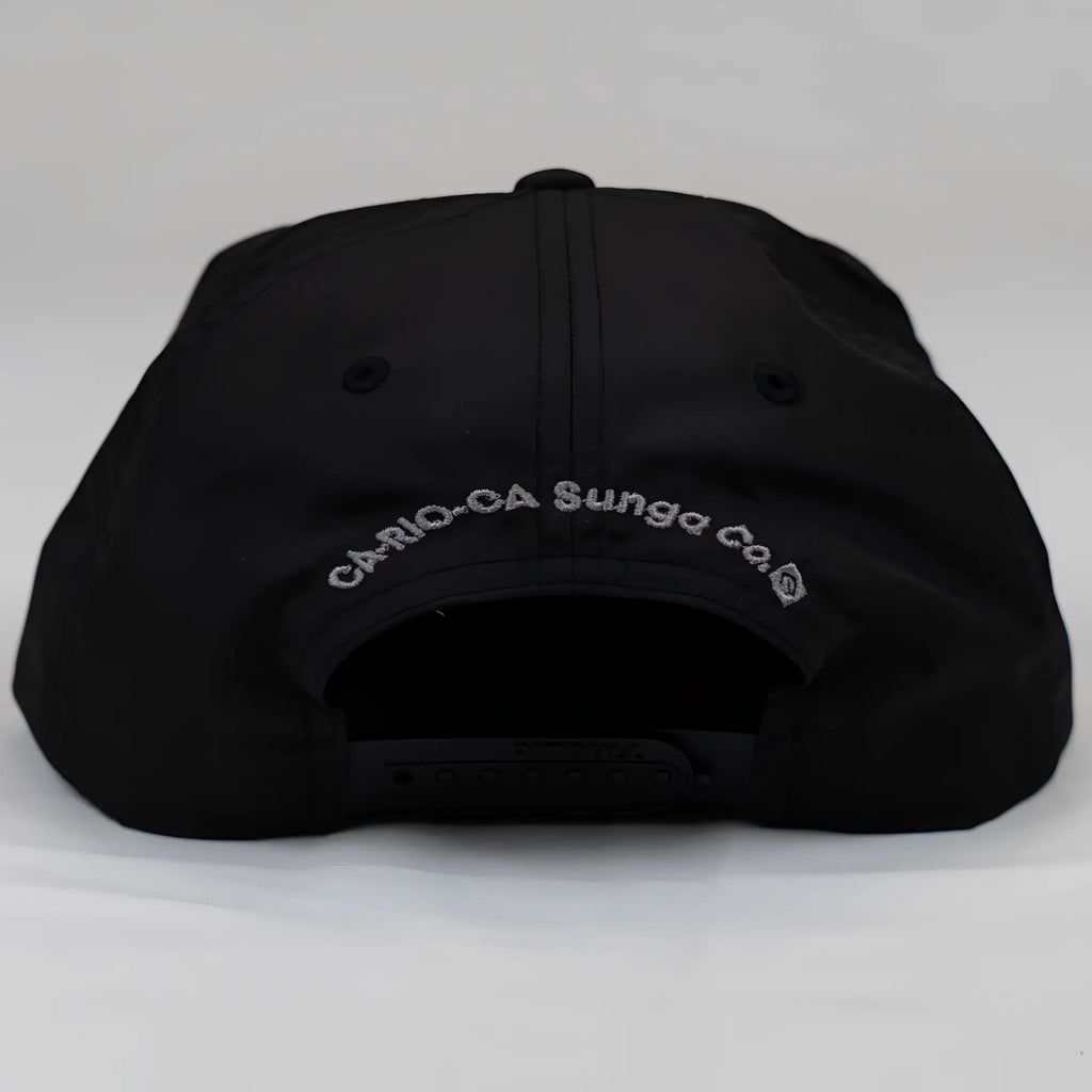 Black ca-rio-ca crest logo unstructured bay leaf snapback rope hat showing silver embroidered text on the back
