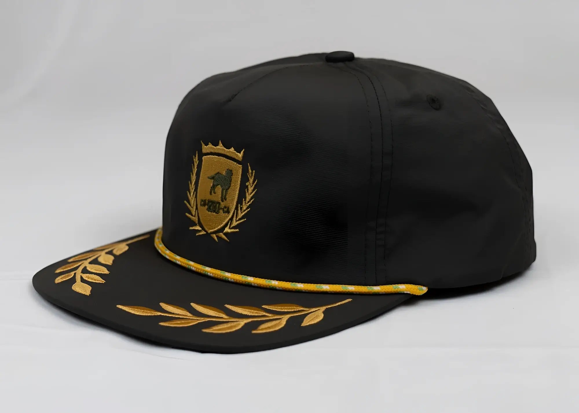 Black unstructured bay leaf snapback rope hat with gold embroidered CA-RIO-CA crest logo and laurel wreath detailing