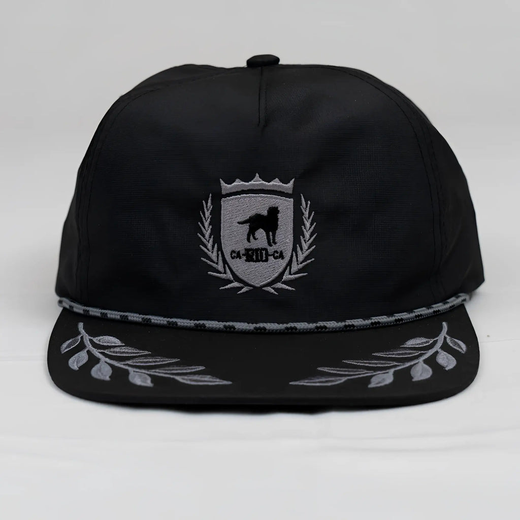 Black unstructured bay leaf snapback rope hat with silver embroidered ca-rio-ca crest featuring dog and laurel wreath