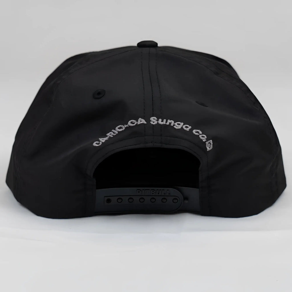 Back side of ca-rio-ca crest logo unstructured bay leaf black snapback cap with white embroidery and adjustable strap