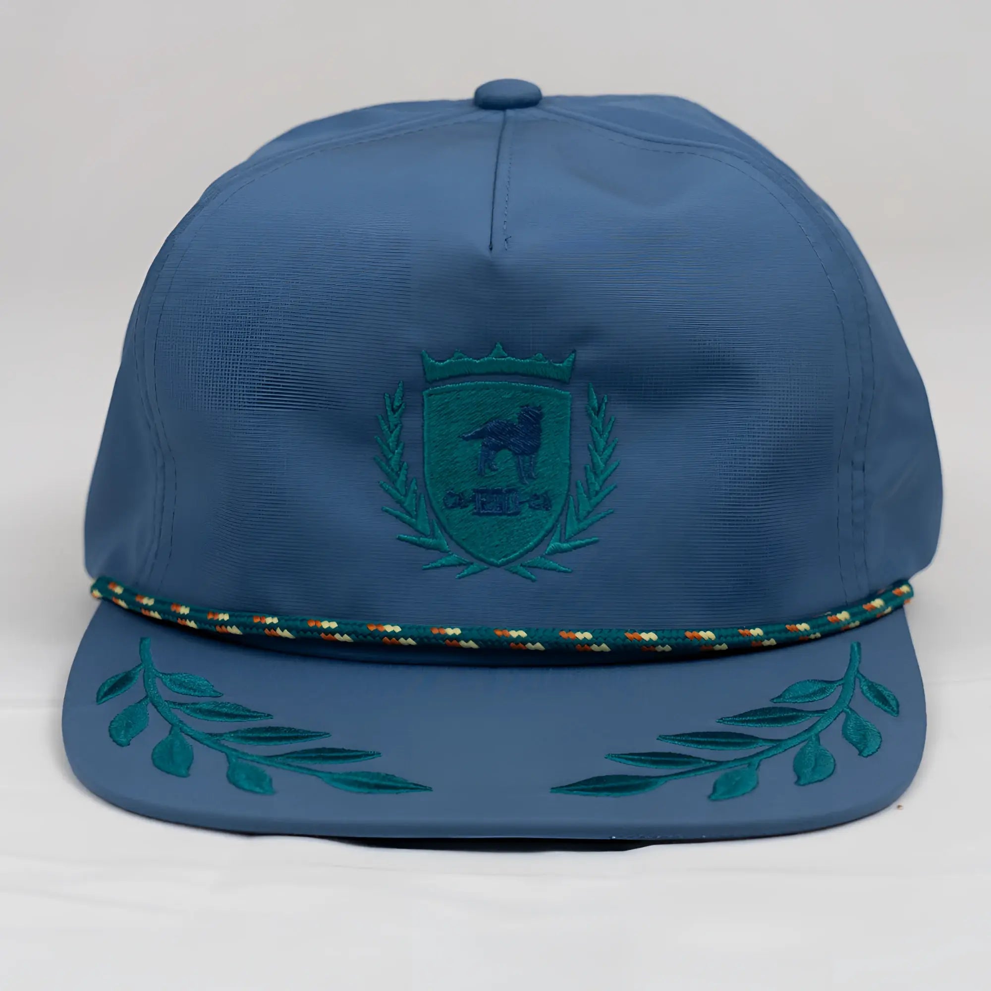 Blue CA-RIO-CA crest logo unstructured bay leaf snapback rope hat with teal embroidered crest and leafy wreath details