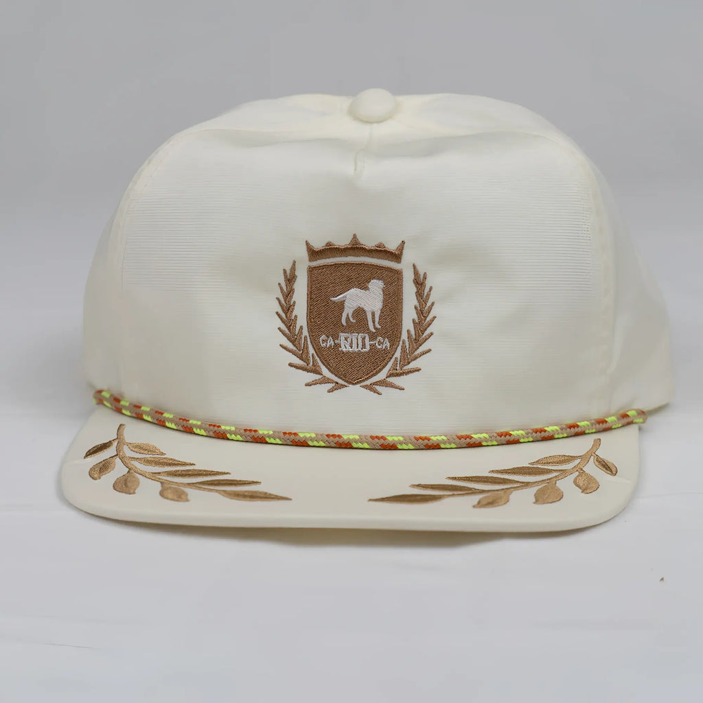 Cream-colored CA-RIO-CA snapback bay leaf hat with embroidered brown shield crest dog crown laurel and gold leaf brim accents
