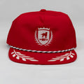 Red unstructured bay leaf snapback rope hat with white dog crest embroidery and black and white striped brim trim