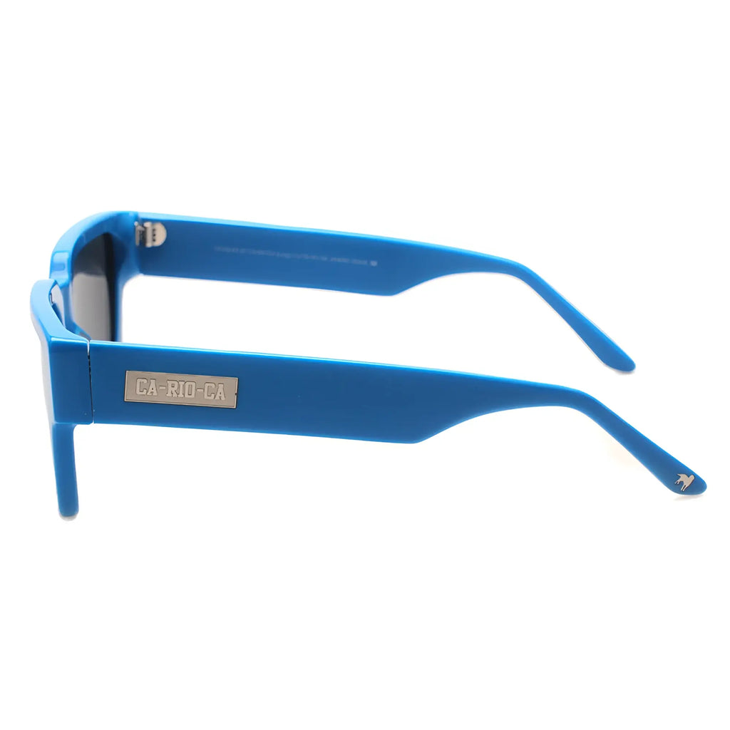 Bright blue rectangular framed ca-rio-ca leblon sunglasses with metallic plaque on the side