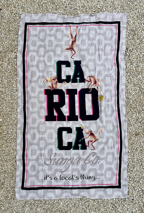 Gray brazilian beach towel with leopard print background black and pink trim featuring carioca text and monkeys