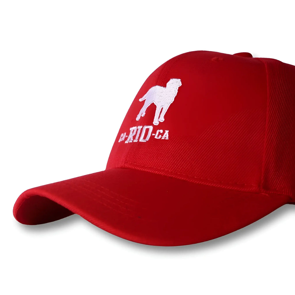 Red ca-rio-ca baseball hat with white embroidered dog silhouette and ca-rid-ga text on cotton fabric
