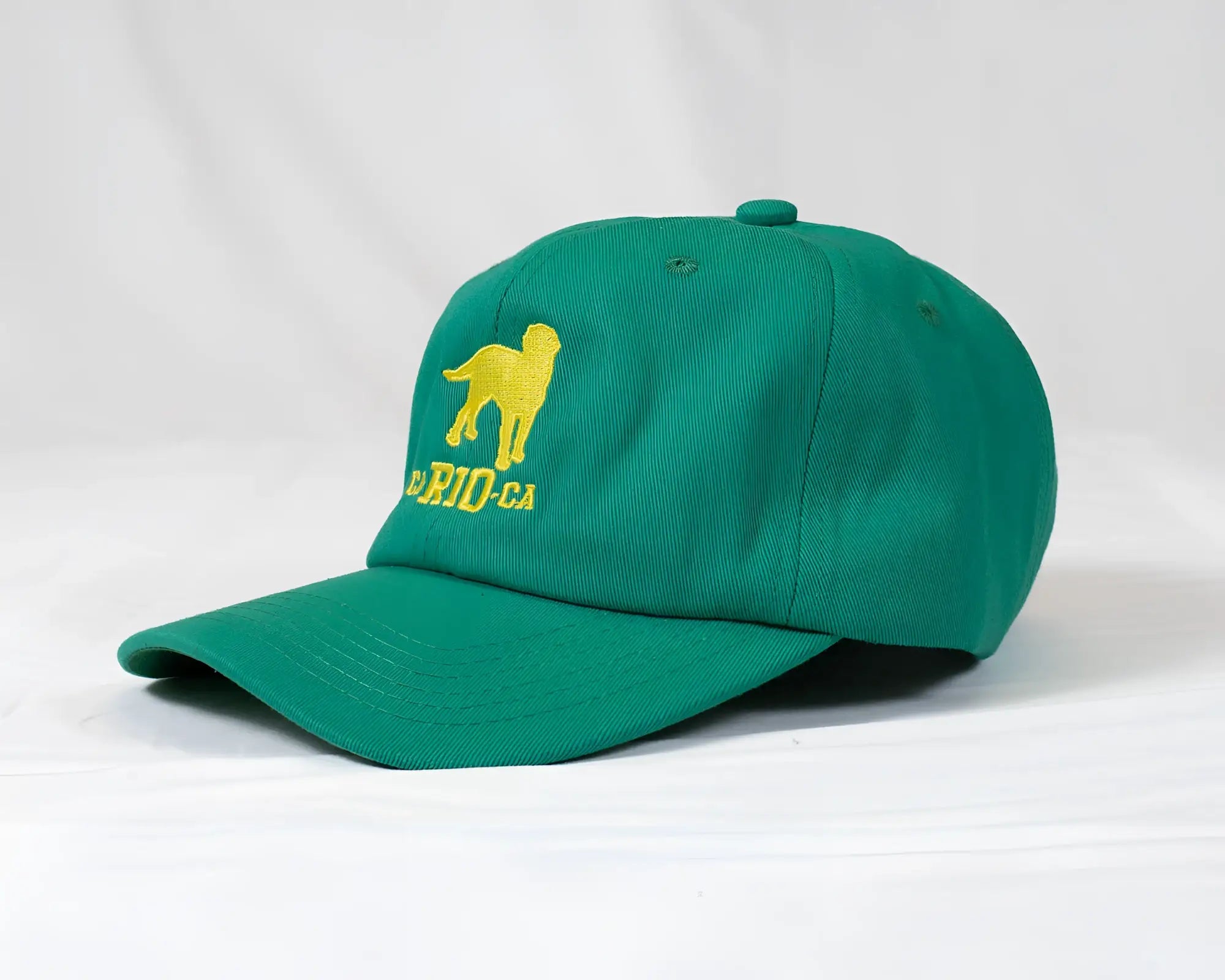 Green ca-rio-ca logo embroidered designer dad hat featuring a yellow dog and rio-ca text for men baseball cap