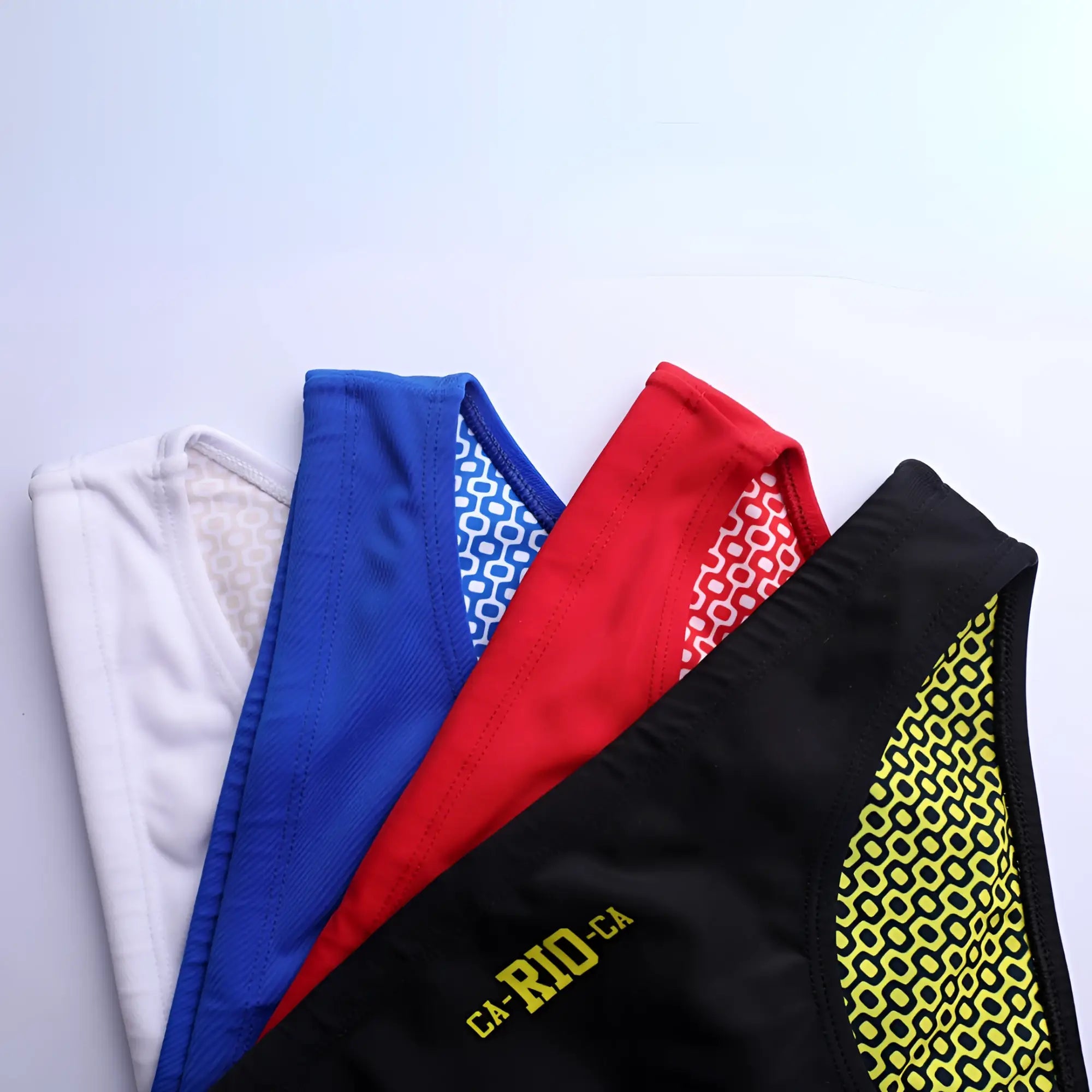 Black athletic swim vest with vibrant yellow geometric side pattern and gold ca-rio-ca logo for men beachwear