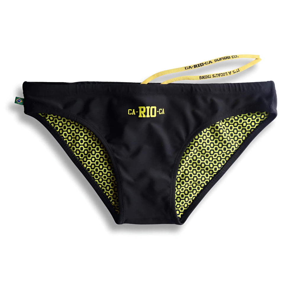 Black men’s swim trunks with lime green geometric side pattern and yellow ca-rio-ca logo for beachwear use