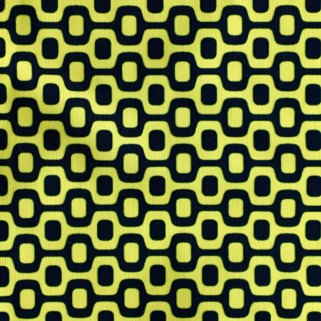Bright yellow ca-rio-ca logo swim bikini with bold black geometric interlocking ovals for men beachwear