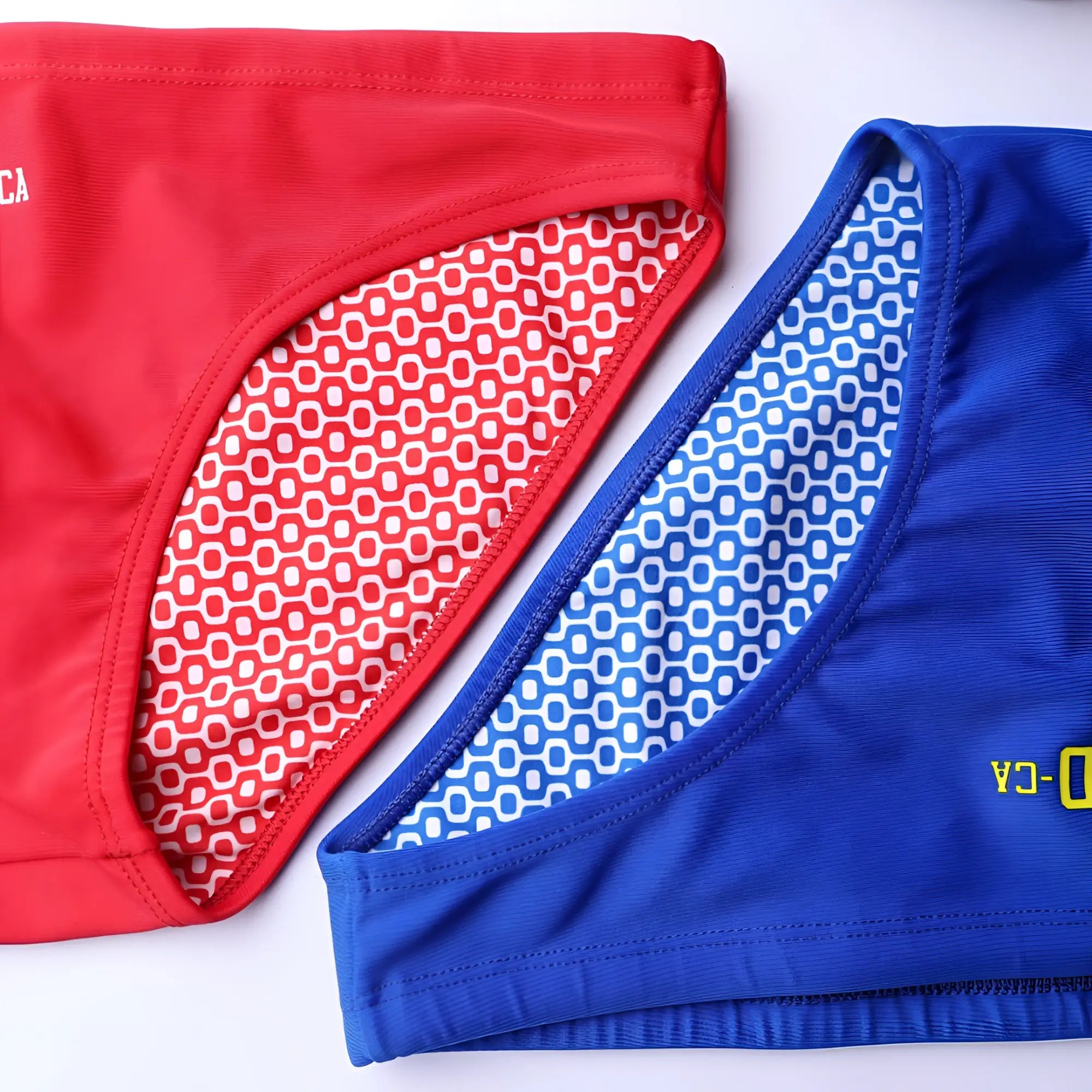 Men’s swimming sunga CA-RIO-CA logo swim bikini in red and blue with geometric pattern inner lining for beachwear