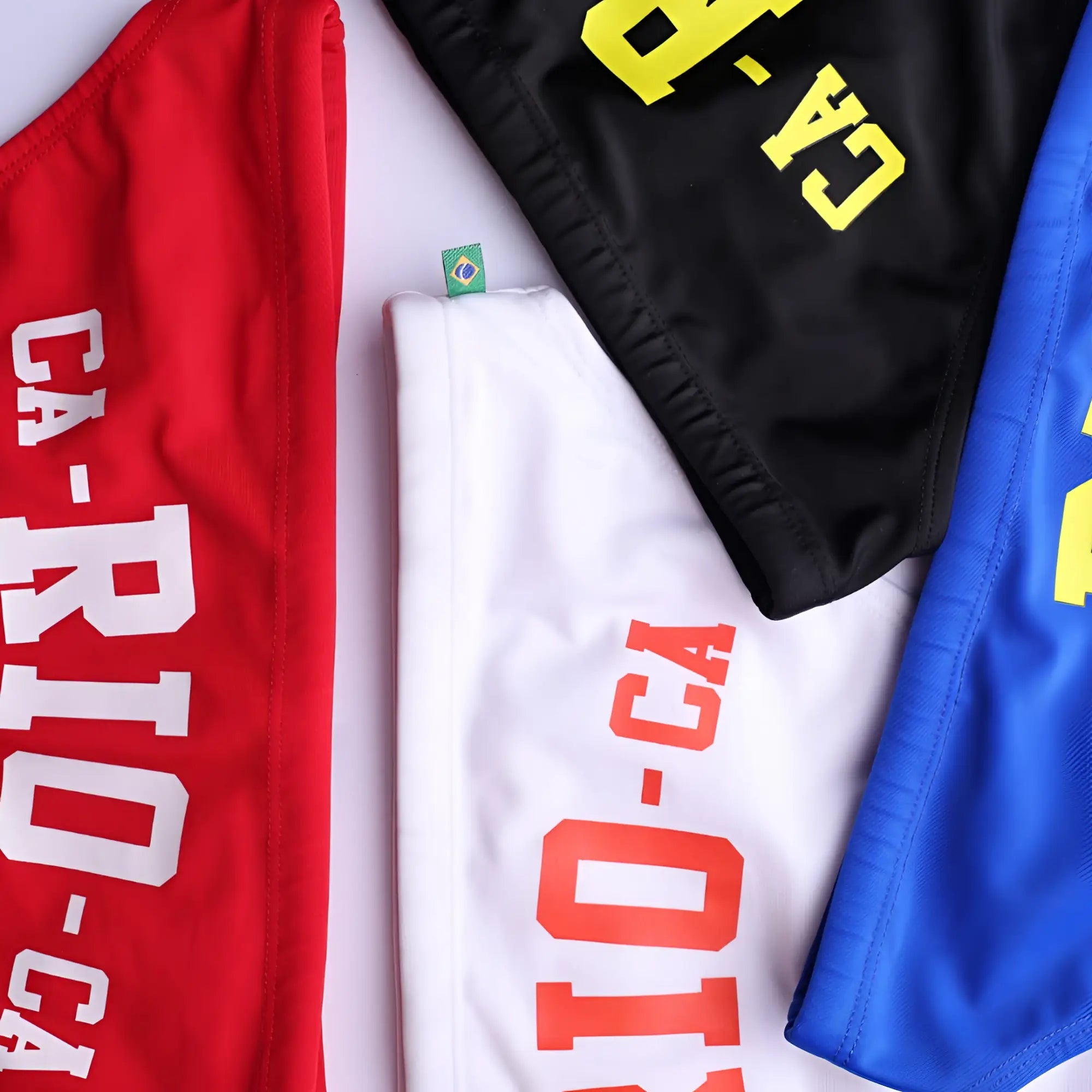Men’s ca-rio-ca logo swim bikini red white and blue athletic shorts with bold rio-ca lettering for beachwear