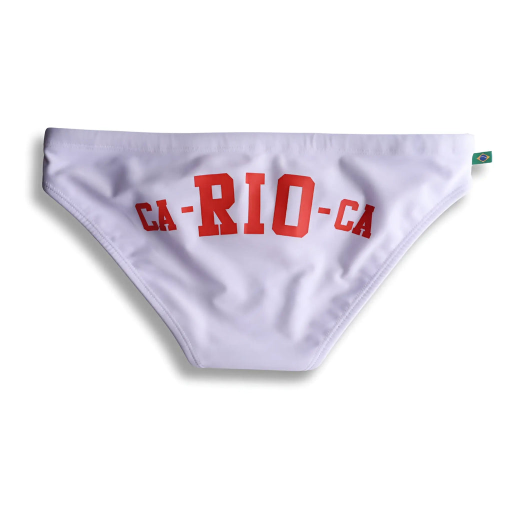White swim trunks with bold red ca-ri0-ca logo lettering for men beachwear in the ca-rio-ca logo swim bikini line