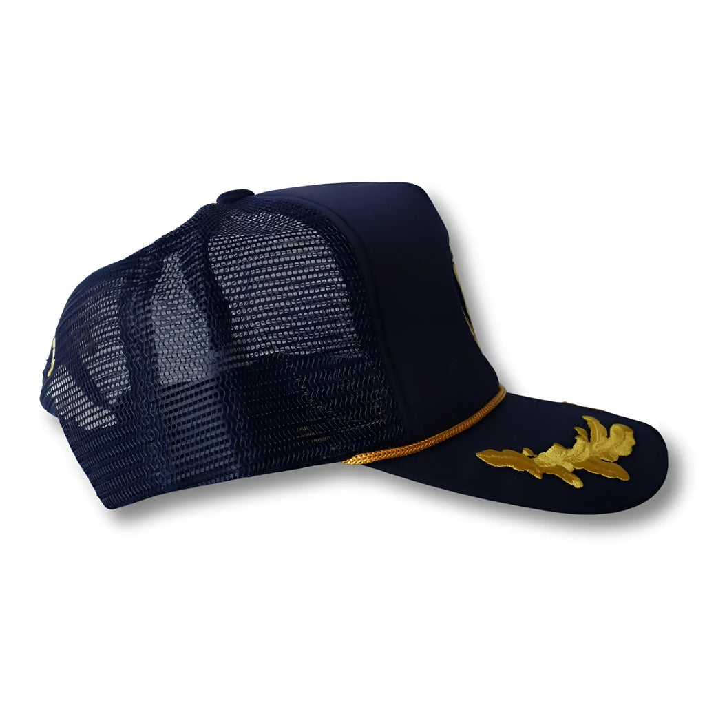 Navy blue ca-rio-ca captain trucker hat with gold embroidered oak leaf design and matching gold trim on brim