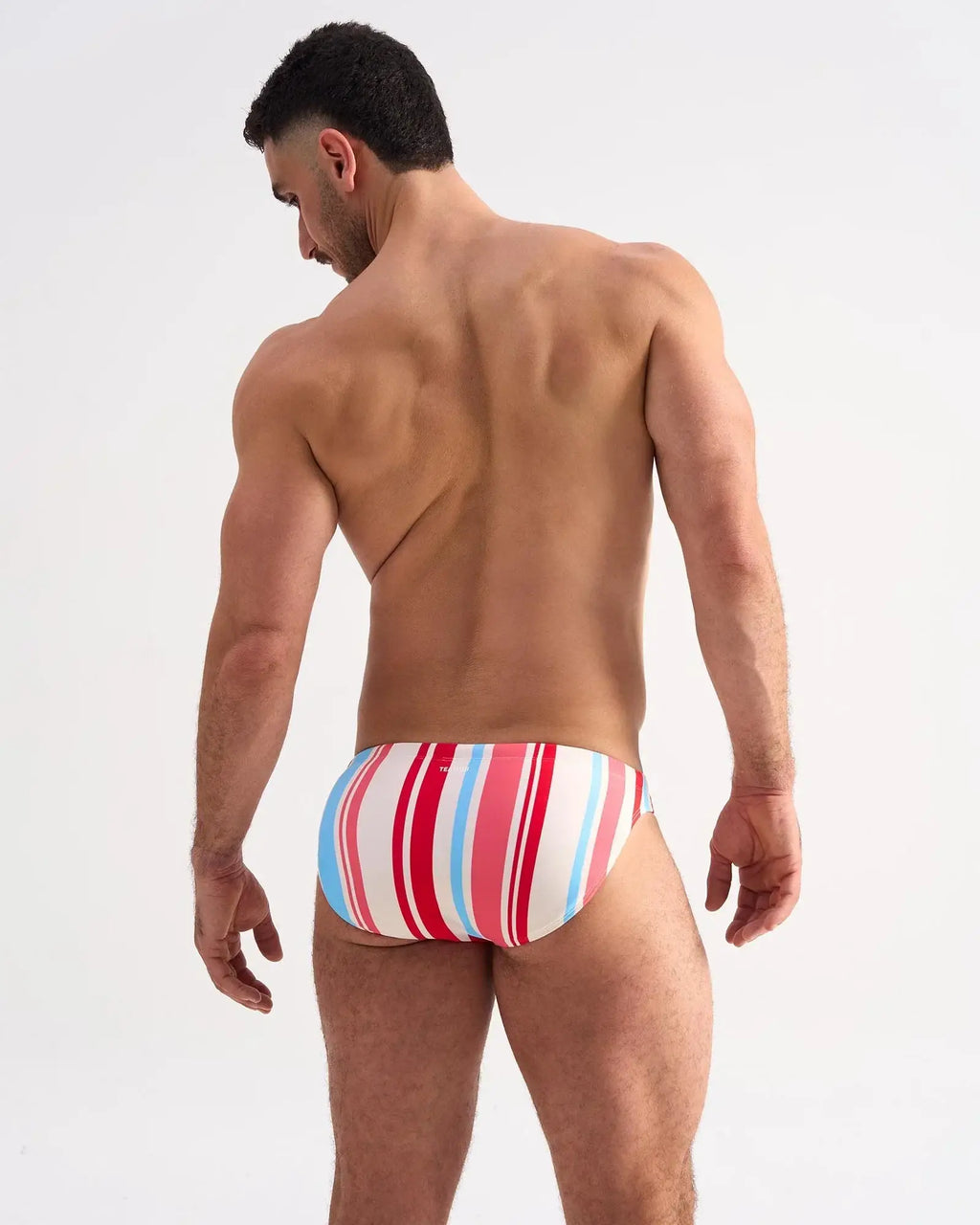 Cabana swim brief with bold red white and light blue vertical striped swim trunks for beach and pool use