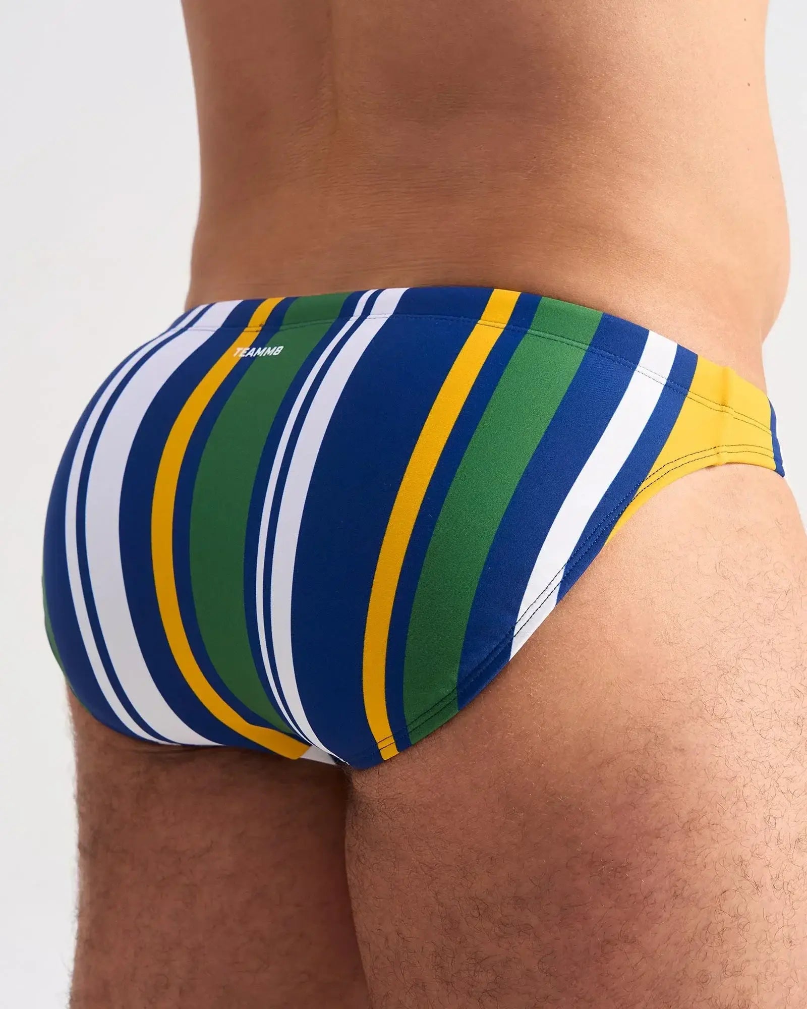 Cabana swim brief vibrant striped swim trunks in bold blue green yellow and white hues for beachwear