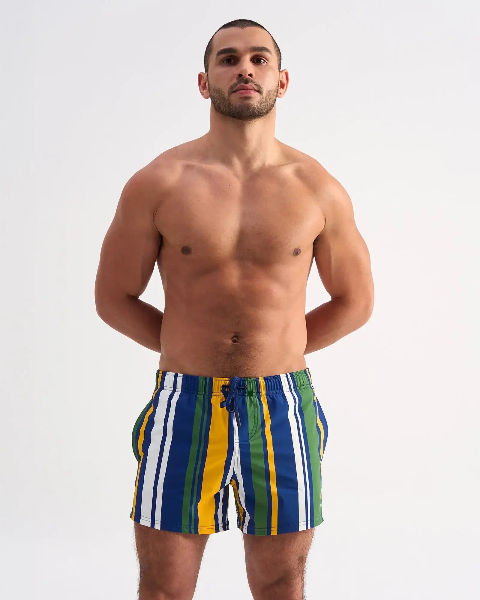 Cabana swim short with vibrant blue green yellow and white vertical stripes and a drawstring waistband