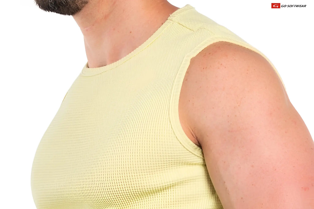 A pale yellow ribbed knit sleeveless top with a crew neckline called so cal sleeveless tee
