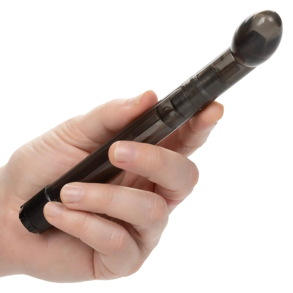 A hand holds a translucent black CalExotics Dr. Joel Kaplan vibrating prostate massager with a rounded tip.