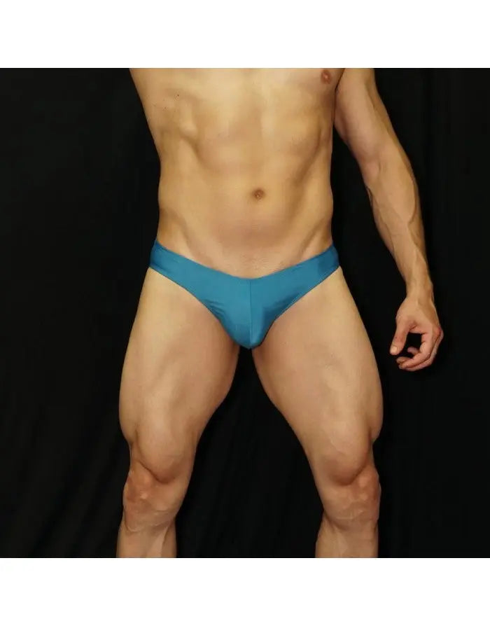 Men's blue bikini swimwear by Arroyman featuring a snug fit and smooth fabric shown on a model.