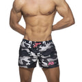 Camouflage swim shorts in black and gray with pink drawstring and logo made for swimming and beachwear