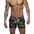 Men’s camouflage swim short with orange drawstring and matching logo patch perfect for beach and pool use