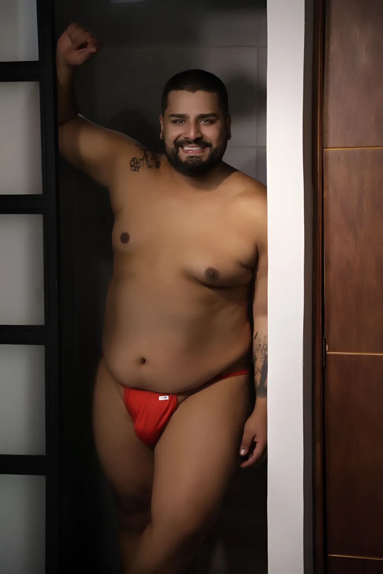 Red CandyMan 9586X thong briefs with a small white logo on the front designed for comfortable daily wear