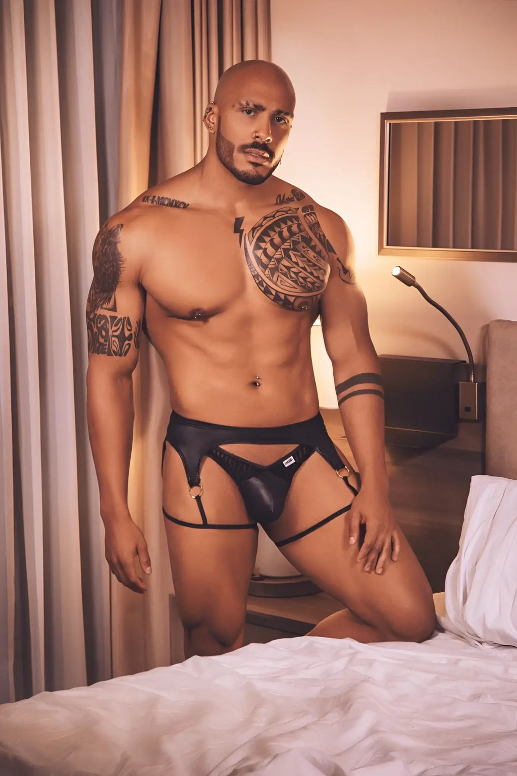 Candyman 99655 black leather thong with adjustable straps and small white logo on the front