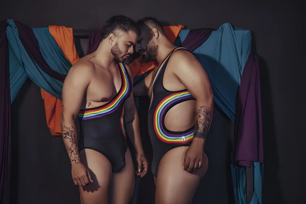 Black CandyMan 99702X one-piece swimsuit with rainbow stripes and cutouts for bold swimwear style