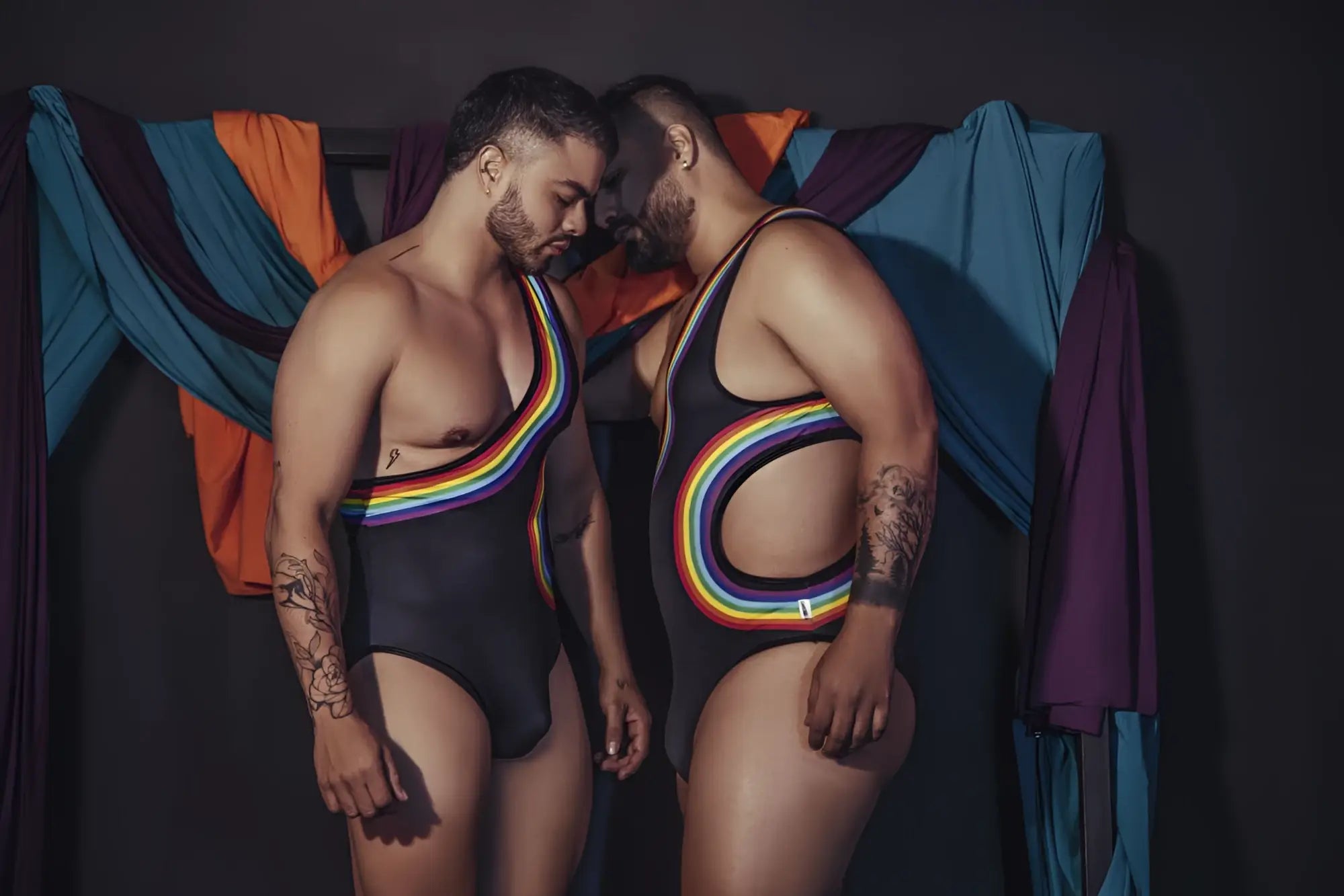 Black CandyMan 99702X one-piece swimsuit with rainbow stripes and cutouts for bold swimwear style