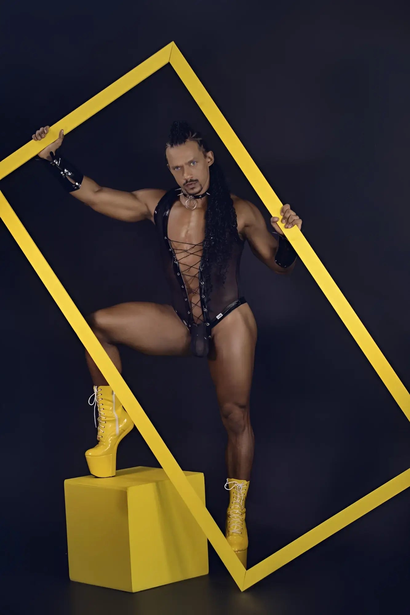 A black CandyMan 99774 gladiator bodysuit with lace-up front, sheer mesh overlay, and corset-style lacing design