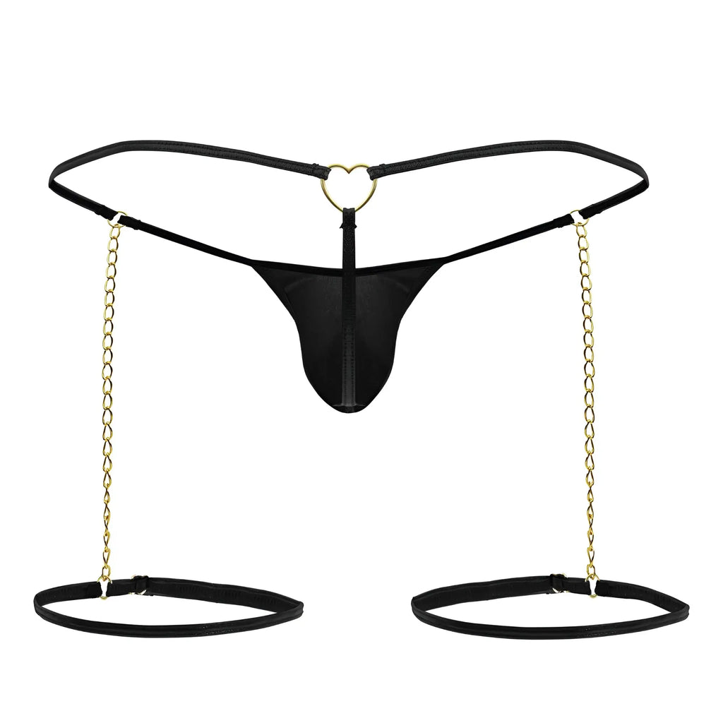 Black thong candyMan 99827 with heart-shaped metal clasp and gold chain garters attached to adjustable ankle cuffs