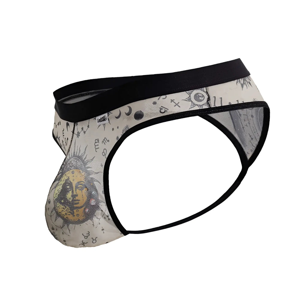 Cream-colored mens briefs with black waistband featuring celestial sun face moons stars and astrological symbols design
