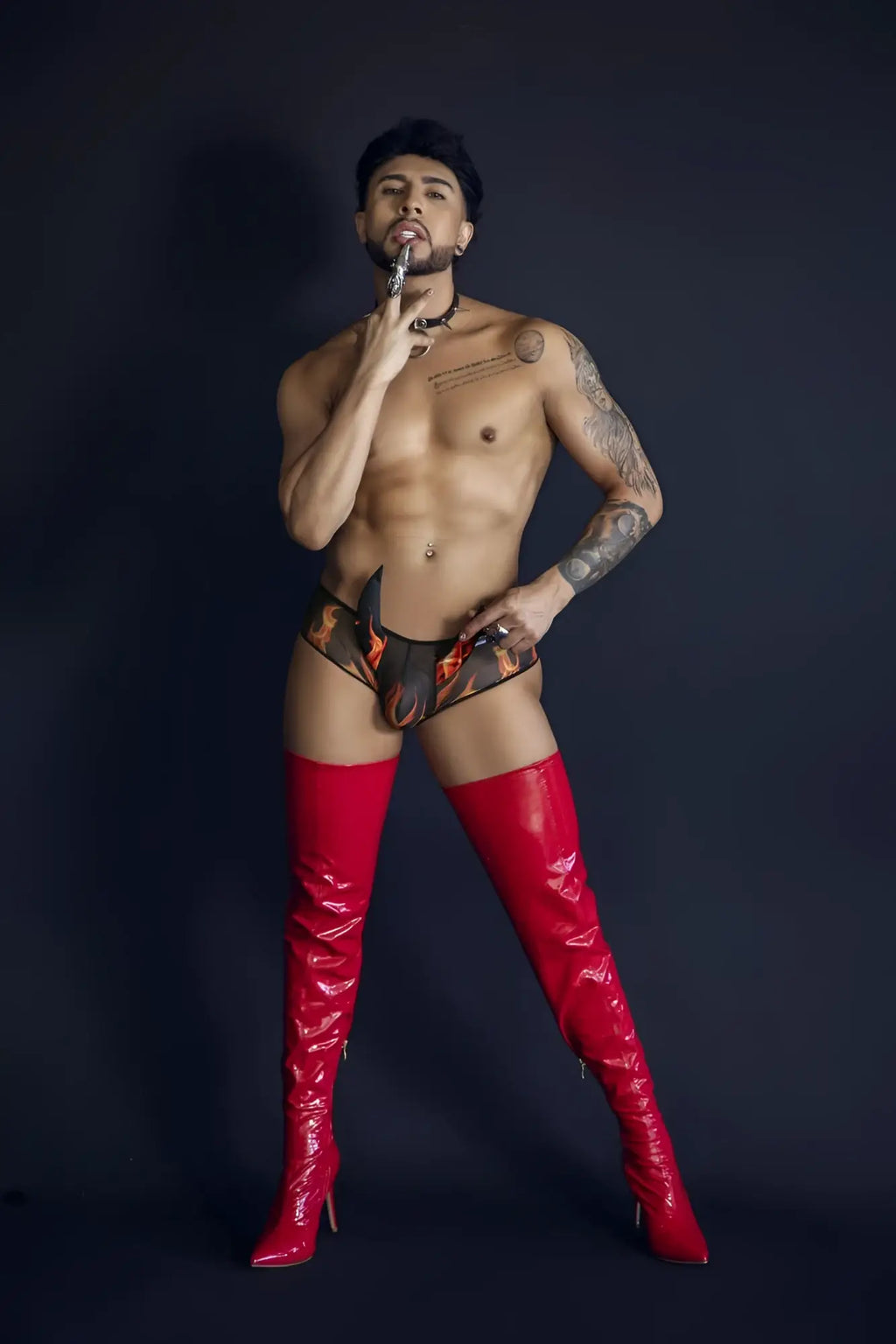Shiny red thigh-high boots made of glossy material featuring candyman 99917 wicked trunks color black design