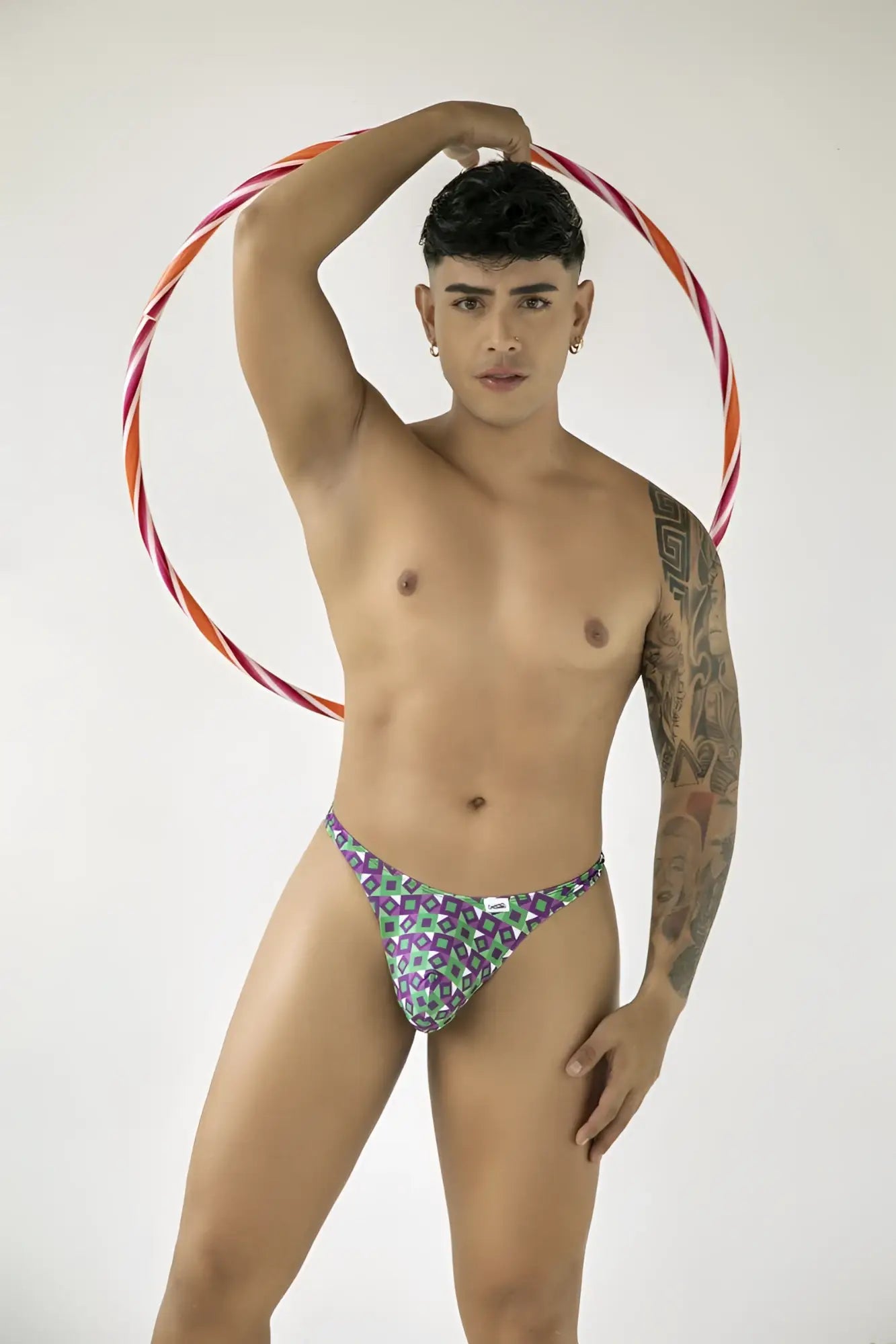 CandyMan 99924 thongs purple patterned briefs with green accents and a small white logo on the front