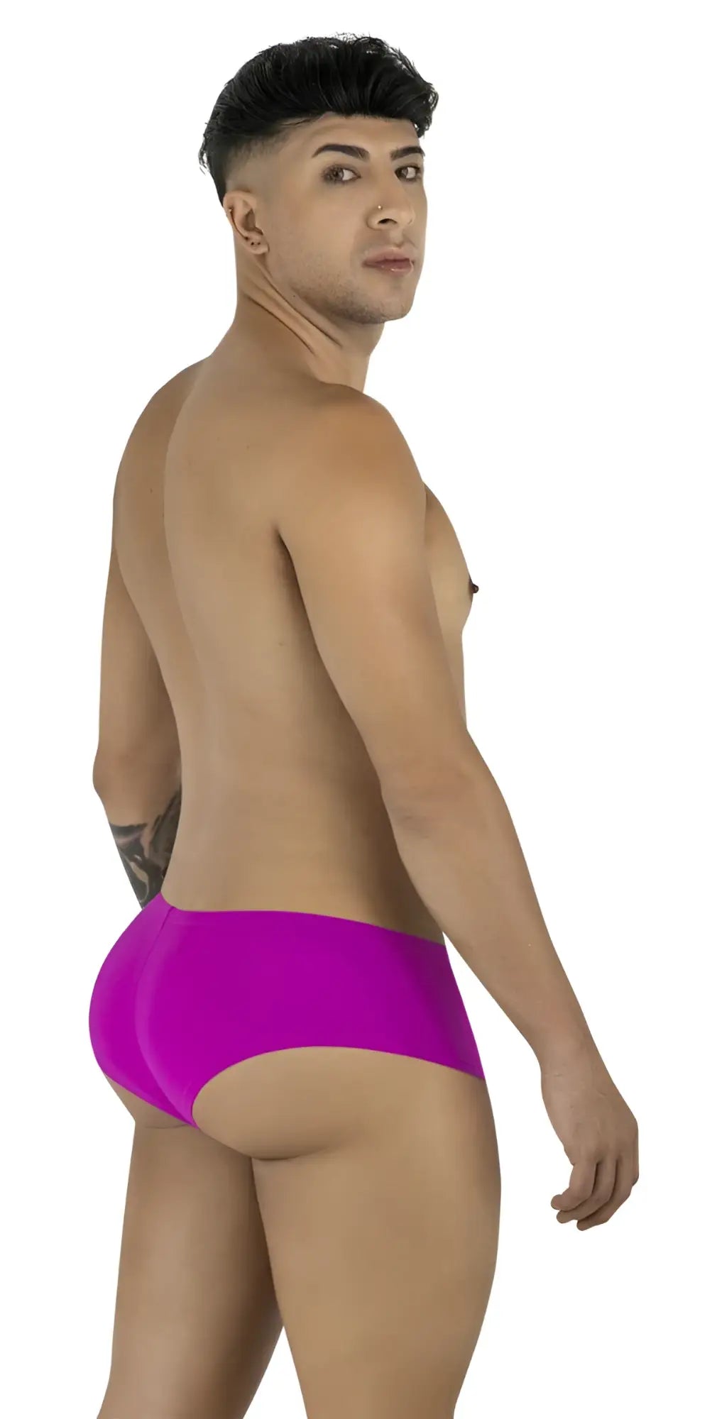Man seen from behind wearing magenta CandyMan 99943 trunks, looking over his shoulder toward the camera.