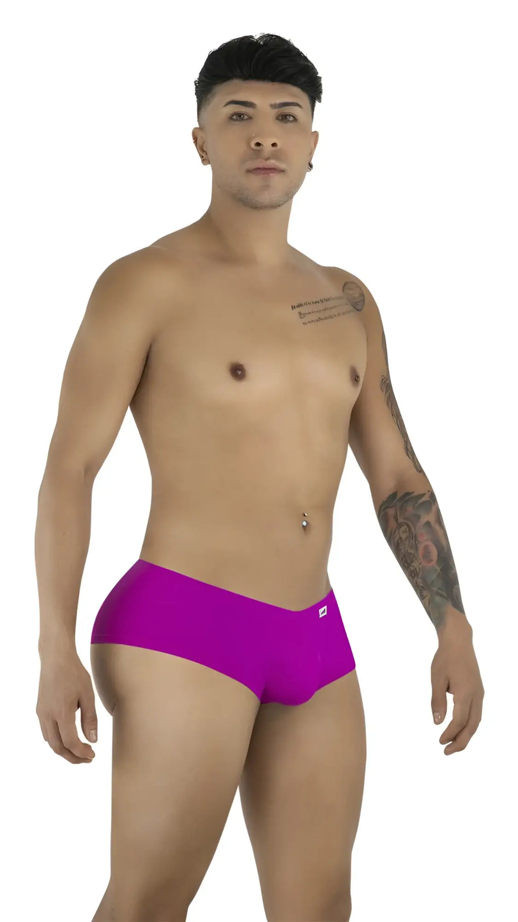 A man modeling magenta CandyMan trunks in a studio pose against a plain white background.