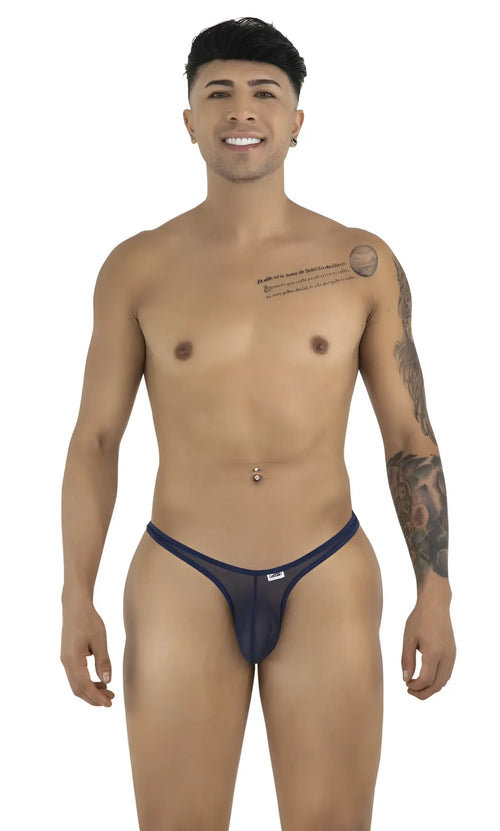 A man stands facing forward, wearing navy mesh CandyMan thongs with a thin double-strap waistband.
