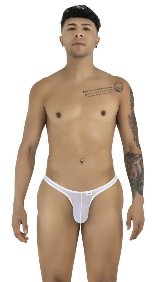 A man models a sheer white mesh thong, standing facing forward against a white background.