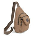 Tan canvas sling bag with adjustable shoulder strap and silver toned zippers for everyday use